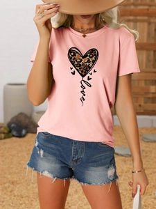 Detail of pink crew neck T-shirt featuring leopard print heart and Love graphic text