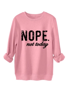 Detailed view of pink cotton sweatshirt featuring Nope not today slogan and ribbed cuffs