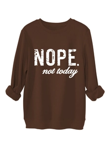 Detail of chocolate brown sweatshirt featuring Nope not today white printed slogan
