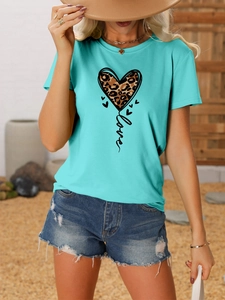 Close-up of leopard heart print and love script on turquoise crew neck short sleeve tee