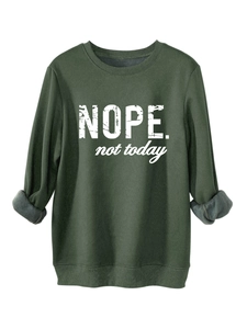 Detail of dark green sweatshirt showing warm gray fleece lining and ribbed cuffs