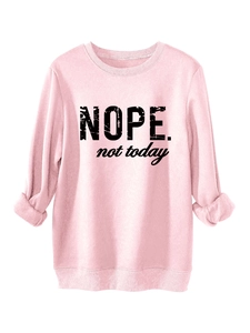 Detail of pink fleece sweatshirt featuring black NOPE not today artistic textured print