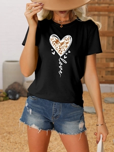 Close-up of black cotton T-shirt featuring leopard print heart and Love typography detail