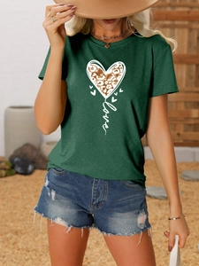 Detail of dark green t-shirt with leopard print heart and love script on fabric