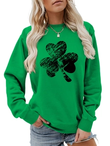 Detail of green women's sweatshirt with distressed black shamrock print and ribbed cuffs