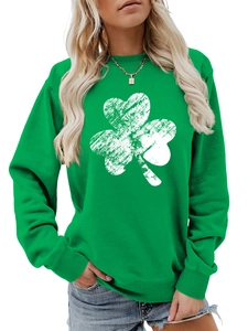 Detail of distressed white shamrock print on a vibrant green crewneck sweatshirt