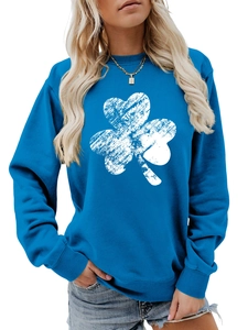 Close-up of blue crewneck sweatshirt with distressed white clover print for women