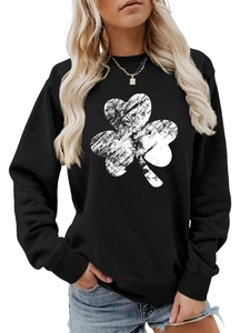 Detail view of a black crewneck sweatshirt with a large distressed white clover print