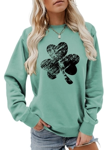 Detail of mint green long sleeve sweatshirt with a distressed black shamrock print