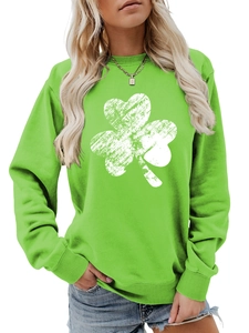 Detail of green sweatshirt with vintage white shamrock print and knit cotton blend texture