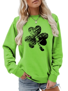 Detail of the green long sleeve sweatshirt featuring a distressed shamrock print design