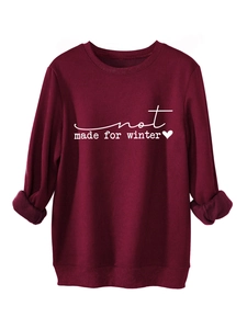 Detail of burgundy fleece sweatshirt featuring not made for winter print and soft lining