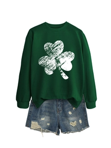 Detail of green crewneck sweatshirt with white shamrock and ripped denim shorts set