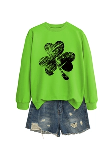Detail of bright green long sleeve sweatshirt with large black clover print and denim shorts