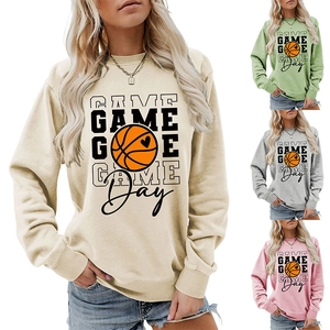 Detail view of Game Day basketball print sweatshirts in beige, green, grey and pink