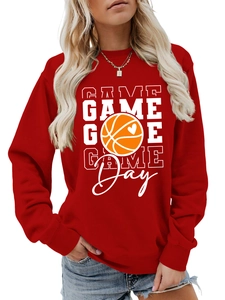 Close-up of red crewneck sweatshirt with white GAME DAY text and basketball heart graphic