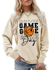 Detail of cream sweatshirt showing ribbed cuffs and Game Day basketball print design