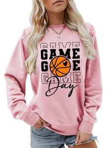 Close-up of pink sweatshirt featuring Game Day basketball heart print and ribbed cuffs