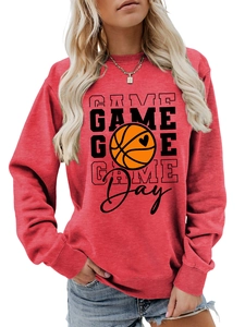 Close-up of red Game Day sweatshirt featuring basketball heart print and ribbed cuffs