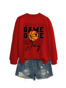 Detail of red Game Day sweatshirt featuring basketball heart print and ripped denim shorts