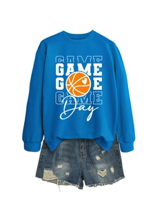 Blue Game Day sweatshirt with basketball graphic paired with ripped denim shorts