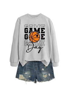 Detail of grey game day basketball sweatshirt paired with distressed denim shorts