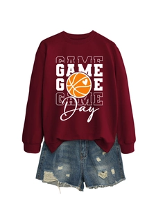 Detail of crimson sweatshirt with Game Day basketball print and distressed denim shorts