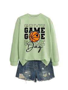 Detail of mint green Game Day sweatshirt and distressed denim shorts streetwear set
