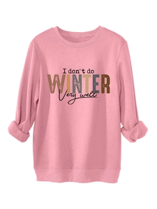 Detail of pink crewneck sweatshirt featuring I don't do winter print and ribbed cuffs