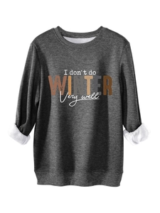 Close-up of thick fleece lining and printed text on a warm dark grey sweatshirt