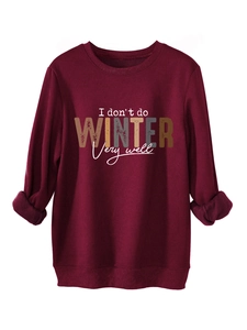 Detail of burgundy fleece sweatshirt with I don't do winter slogan and ribbed cuffs