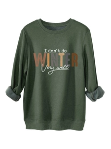 Detail of warm gray fleece lining inside a dark green sweatshirt with collar stitching