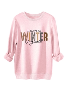 Detail of pink fleece sweatshirt showing I don't do winter slogan and ribbed cuffs