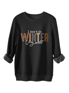 Detail of fleece lining and slogan print on a black winter sweatshirt for women