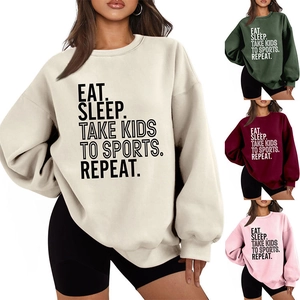 Detail of the soft fabric texture and the sports slogan print on the fleece sweatshirt