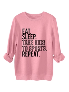 Detail of pink fleece sweatshirt with black lettering and ribbed cuffs for women