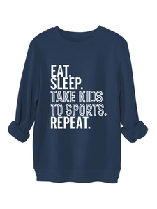 Close-up of ribbed crewneck and white printed slogan on navy fleece sweatshirt
