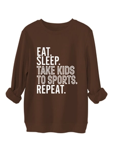Detail of Eat Sleep Take Kids slogan on brown fleece sweatshirt with ribbed cuffs