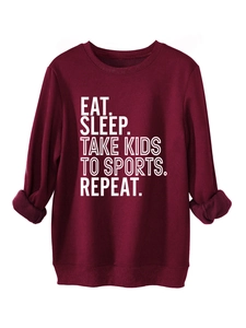 Detail view of burgundy fleece-lined sweatshirt showing cozy interior fabric texture
