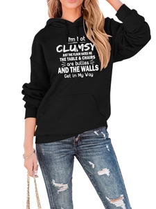 Detail of black hoodie with white slogan print, drawstring hood and kangaroo pocket