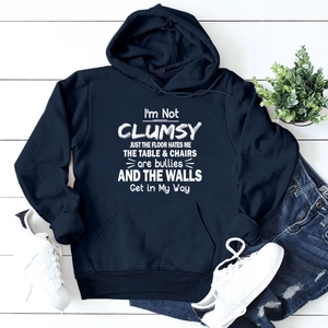 Navy blue hoodie with white funny lettering and large front pocket on wood floor