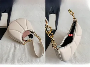 Detailed interior of cream shell bag showing main pocket storage capacity for essentials
