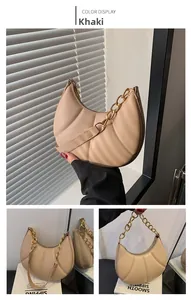 Detail of khaki crescent shoulder bag featuring pleated PU leather and gold chain strap