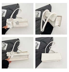 Detailed views of a white baguette shoulder bag with silk scarf handle and crystal buckle