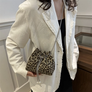 Trendy leopard print bucket bag with pearl drawstring and silver chain shoulder strap