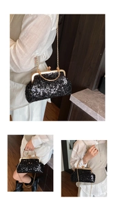 Close-up of black sequined shell bag with golden metal frame and chain shoulder strap