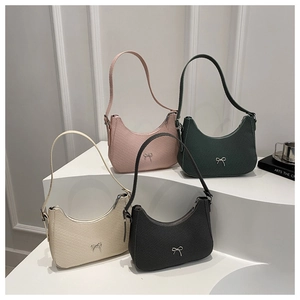French vintage style woven shoulder bags with metallic bow details in four colors