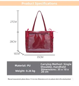 Detail view of red PU tote bag with clear PVC front pocket and decorative ribbon details