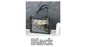 Detail of black glossy ita bag showing large clear window and ribbon lace-up sides
