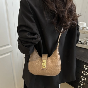 Chic camel woven textured crescent shoulder bag for women with golden metal buckle
